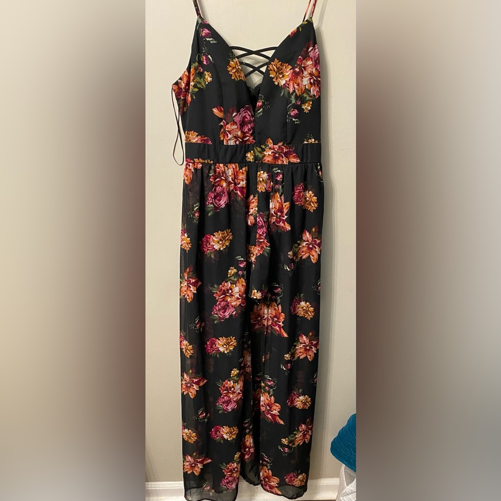 Black short/long romper, size large, worn once. Good condition.